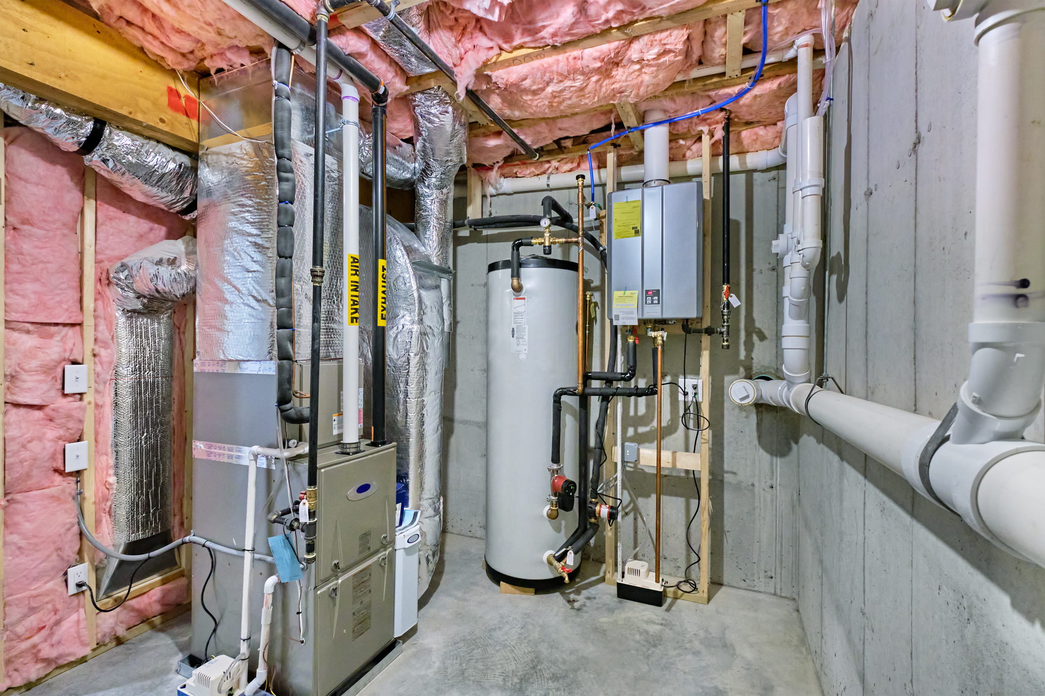 Unfinished basement with furnace and water heater