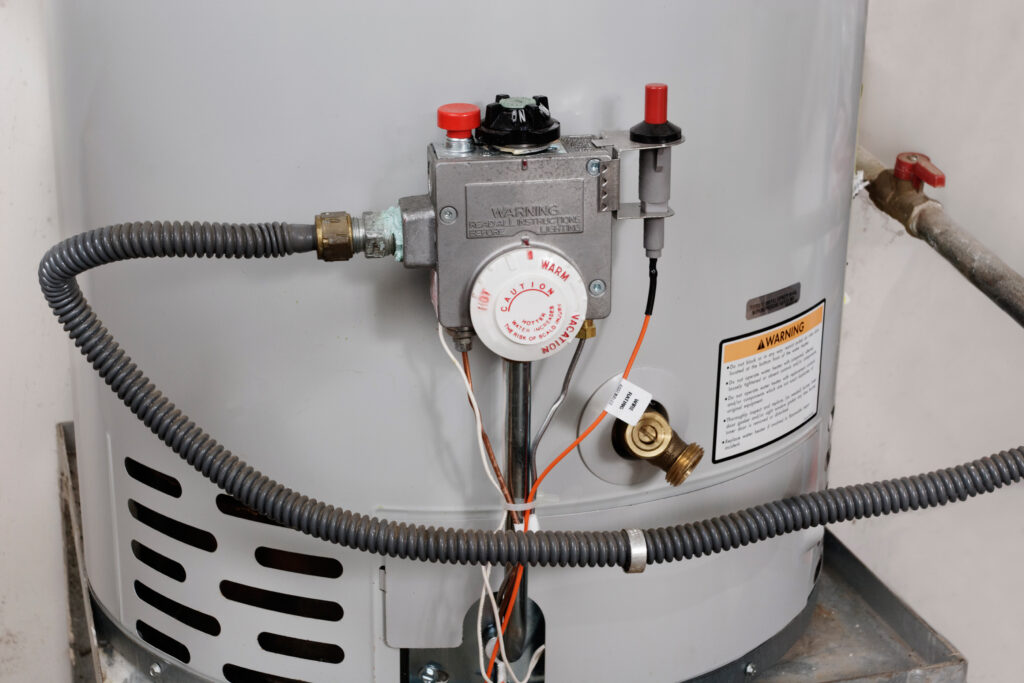 Gas water heater with controls visible