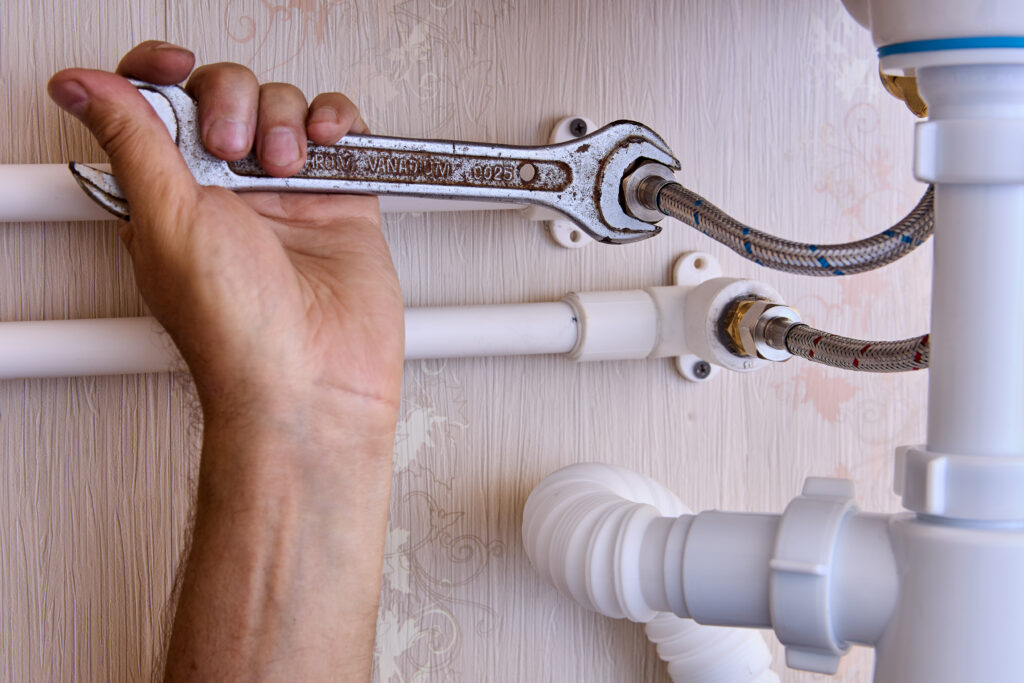 plumber tightening water line